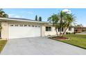 Attached garage with a spacious driveway at 1009 Pineview Ave, Clearwater, FL 33756