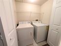 Bright laundry room with washer and dryer included at 1185 Villagio Cir # 207, Sarasota, FL 34237