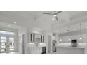 Open-concept kitchen and living area with white cabinets and modern finishes at 16381 Cape Horn Blvd, Punta Gorda, FL 33955