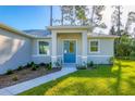 House with a blue door and walkway at 2814 Daphne Rd, North Port, FL 34288