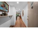 Bright condo entryway with wood floors at 3700 S Osprey Ave # 214, Sarasota, FL 34239
