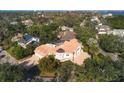 Large home with tile roof and pool, situated in a residential neighborhood near the coast at 5331 Siesta Cove Dr, Sarasota, FL 34242