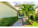 Charming front porch with white adirondack chairs, a walkway, and fall decor at 5352 Fairfield Blvd, Bradenton, FL 34203