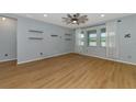 Living room with wood-look floors and ceiling fan at 7746 108Th Avenue E Cir, Parrish, FL 34219
