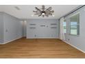 Living room with wood-look floors and ceiling fan at 7746 108Th Avenue E Cir, Parrish, FL 34219