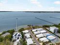 Breathtaking aerial view of a charming community with waterfront access and stunning ocean views at 2107 Palma Sola Blvd # 94, Bradenton, FL 34209