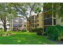 Condo building exterior showcasing a unit with a private balcony at 315 30Th W Ave # B311, Bradenton, FL 34205