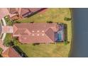 Bird's eye view of home showcasing roofline and pool at 4612 Stickley Ct, Palmetto, FL 34221
