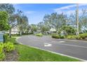 Gated community entrance with landscaped medians and curved driveway at 4708 Sabal Key Dr, Bradenton, FL 34203