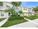 Row of townhouses with pastel-colored exteriors and lush landscaping at 4708 Sabal Key Dr, Bradenton, FL 34203