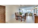 Inviting dining room features stylish lighting, tile floors, and access to living area at 8706 54Th W Ave # 18, Bradenton, FL 34210