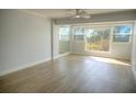 Bright living room with large windows and hardwood floors at 33 S Gulfstream Ave # 307, Sarasota, FL 34236