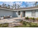 Inviting front porch with a stone walkway and landscaping at 5470 80Th Avenue E Cir, Palmetto, FL 34221