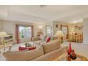 Bright living room featuring comfortable seating and dining area at 381 Bobby Jones Rd # 381, Sarasota, FL 34232