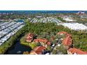 Aerial view of building near lake and other buildings at 4134 Central Sarasota Pkwy # 1734, Sarasota, FL 34238