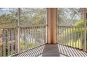 Private screened balcony overlooking trees and water at 4134 Central Sarasota Pkwy # 1734, Sarasota, FL 34238