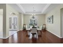 Bright dining room with hardwood floors and chandelier at 575 Fore Dr, Bradenton, FL 34208