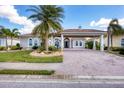 One-story house with attractive landscaping and driveway at 575 Fore Dr, Bradenton, FL 34208