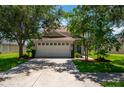 Two-story home with attached garage and landscaped yard at 6227 Blue Runner Ct, Lakewood Ranch, FL 34202
