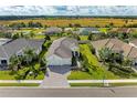 Luxury home with tile roof and a large backyard at 1049 River Wind Cir, Bradenton, FL 34212