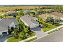 Luxury home with tile roof and pool in the backyard at 1049 River Wind Cir, Bradenton, FL 34212
