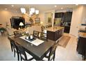 Open kitchen with island and breakfast bar at 135 Ventosa Pl, Nokomis, FL 34275