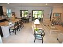 Open concept kitchen and living area at 135 Ventosa Pl, Nokomis, FL 34275