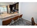 Kitchen with breakfast bar and granite countertops at 1508 Pelican Cove Rd # Gr233, Sarasota, FL 34231