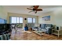 Bright living room with hardwood floors and a balcony view at 2901 26Th W St # 818, Bradenton, FL 34205