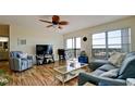 Comfortable living room featuring hardwood floors and ceiling fan at 2901 26Th W St # 818, Bradenton, FL 34205