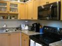 Well-equipped kitchen with ample counter space and storage at 3820 Ironwood Ln # 106-I, Bradenton, FL 34209