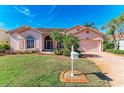 Attractive single-story home, featuring a large driveway and neat landscaping at 4245 Hearthstone Dr, Sarasota, FL 34238