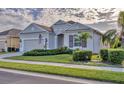 One-story house with nicely landscaped yard and a two-car garage at 12706 Lake Silver Ave, Bradenton, FL 34211