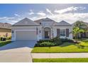 Well maintained home with lush landscaping and inviting front porch at 12706 Lake Silver Ave, Bradenton, FL 34211