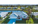 Aerial view of a charming house near a canal at 1318 Bottlebrush Dr, Bradenton, FL 34208