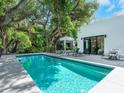 Inviting swimming pool with lounge chairs and patio area at 1331 Quail Dr, Sarasota, FL 34231