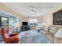 Spacious living room with comfortable seating and a large TV at 2724 Clubhouse Dr # 104, Sarasota, FL 34232