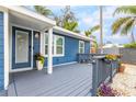 Front porch with gray deck and potted plants at 4403 Pike Ave, Sarasota, FL 34233