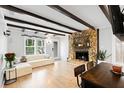 Living room with hardwood floors and stone fireplace at 4403 Pike Ave, Sarasota, FL 34233
