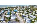 Aerial view showing home's proximity to the beach, a short 6-minute walk away at 243 S Harbor Dr, Holmes Beach, FL 34217