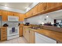 Well-lit kitchen features ample cabinet space and modern appliances at 3375 Sandleheath # 34, Sarasota, FL 34235