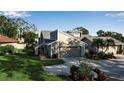 Tan two-story house with a two-car garage at 3410 Avenida Madera # B, Bradenton, FL 34210