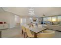 Elegant dining room with a marble table and ocean view at 535 Sanctuary Dr # C807, Longboat Key, FL 34228