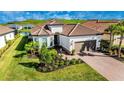 Single-story home with landscaping and driveway at 6249 Mesa Gln, Bradenton, FL 34203