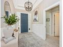 Elegant entryway with modern chandelier and console table at 6249 Mesa Gln, Bradenton, FL 34203