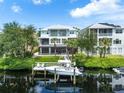 Private dock with boat, offering waterfront access and views at 741 Shakett Creek Dr, Nokomis, FL 34275