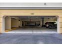 Covered parking garage with several cars parked at 980 Cooper St # 302, Venice, FL 34285