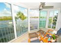 Relaxing sunroom with water views and comfortable seating at 1350 N Portofino Dr # 302Tar, Sarasota, FL 34242