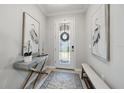 Bright and airy entryway with decorative accents at 2520 Avolet Ct, Bradenton, FL 34211