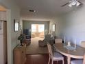 View from entryway to living area and dining space at 611 Gulf N Dr # D24, Bradenton Beach, FL 34217